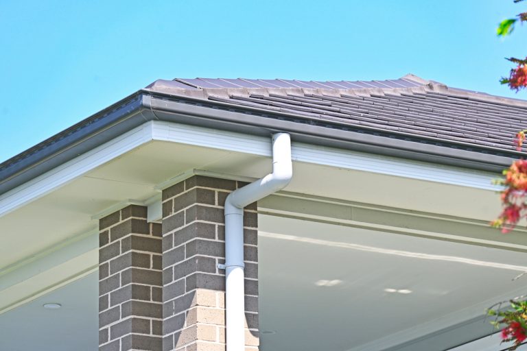 House gutter and downpipe on brick exterior