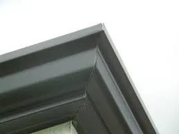 Close-up of grey metal window frame corner