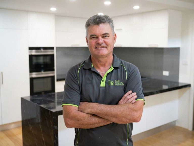 James Officer standing in modern renovated kitchen