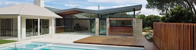 Modern coastal home with pool and timber deck