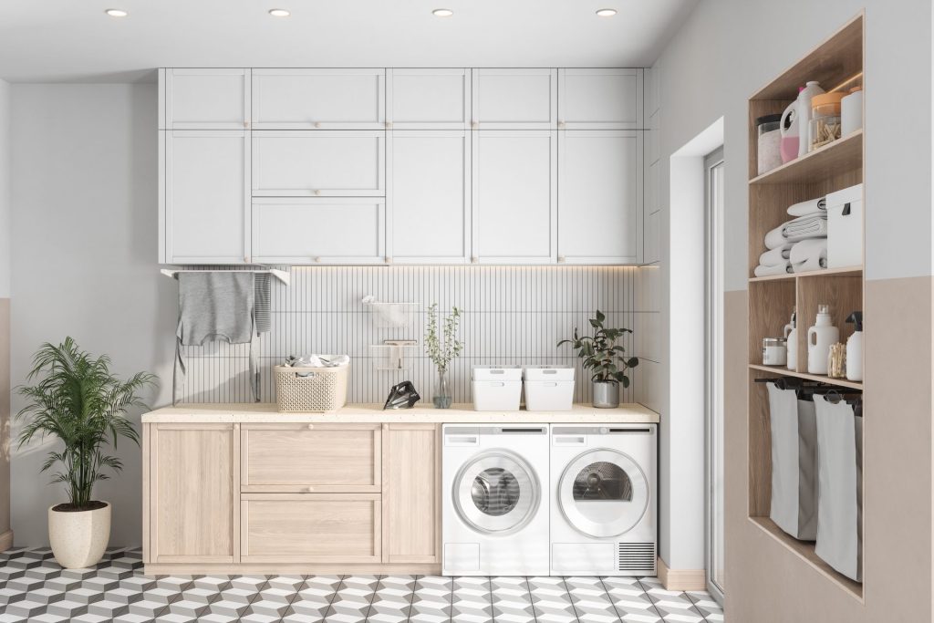 Modern laundry room with washer, dryer and cabinets