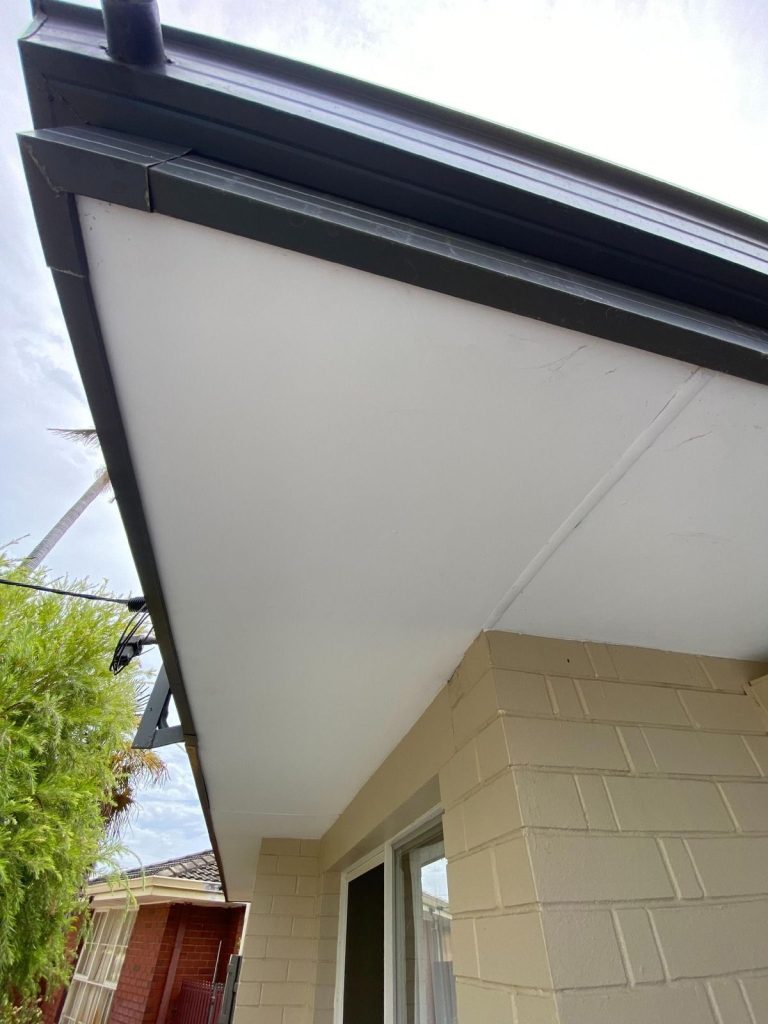 House eaves and guttering on brick exterior